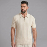 Man wearing a beige stripe jacquard knit zip-up polo shirt front view on plain background
