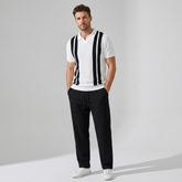 Side view of man in beige striped knit Johnny collar polo and waffle drawstring pants