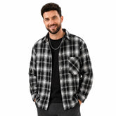MannerCo black plaid lapel shirt with long sleeves and relaxed fit worn by male model