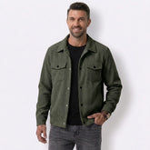 Man wearing MannerCo dark brown corduroy single-breasted lapel jacket, front view on plain background