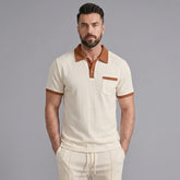 Man wearing a khaki color block waffle polo shirt and straight leg pants front view on plain background