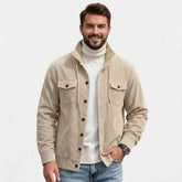 MannerCo men's khaki corduroy jacket with stand collar, front view over white turtleneck