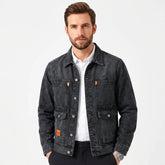 MannerCo men's washed black relaxed fit workwear denim jacket over a white shirt, front view