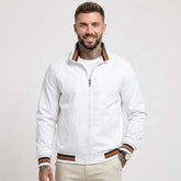 Man wearing MannerCo white waterproof windbreaker jacket with stand collar, front view