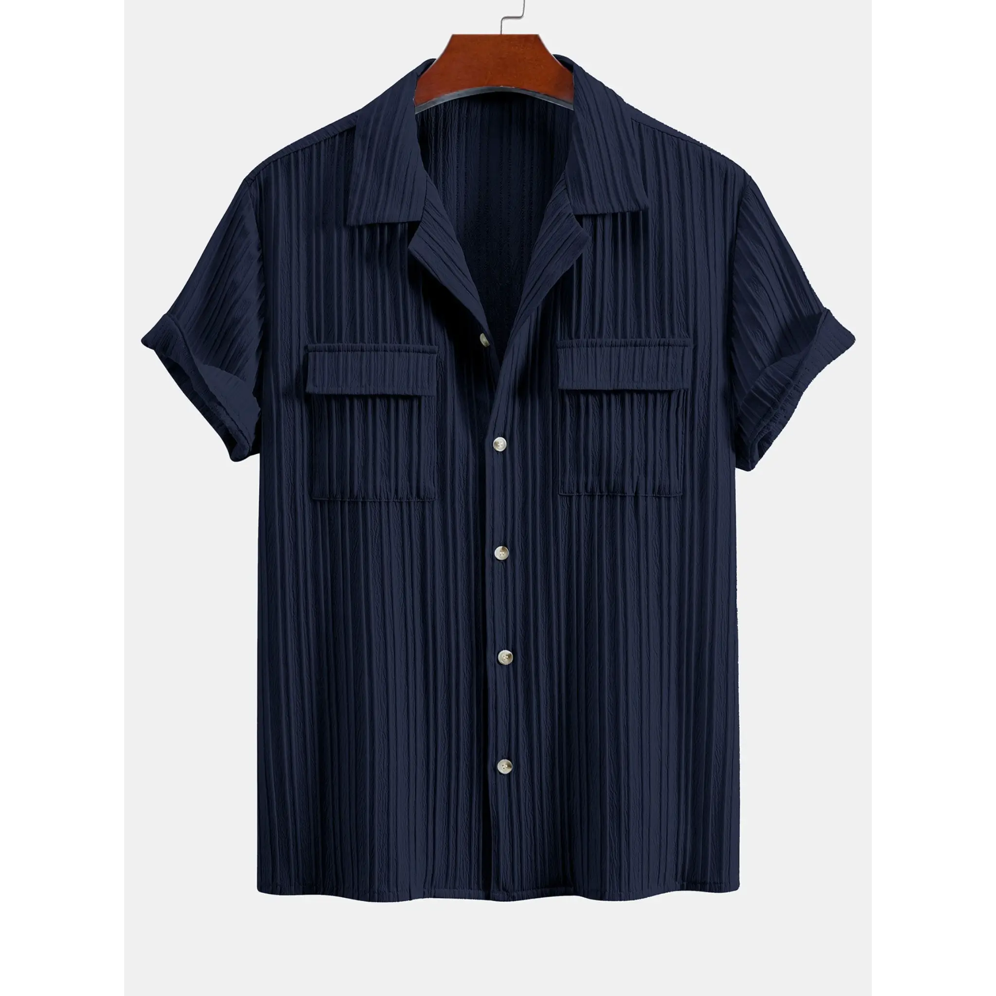 Navy pleated shirt on a hanger with a white background