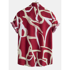 Back view of red abstract print camp collar shirt.