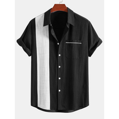 Black and white striped shirt on a hanger with a white background
