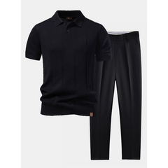 Black short-sleeve shirt and pants set on a white background