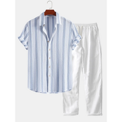 Blue and white striped shirt and pants set on a hanger against a white background
