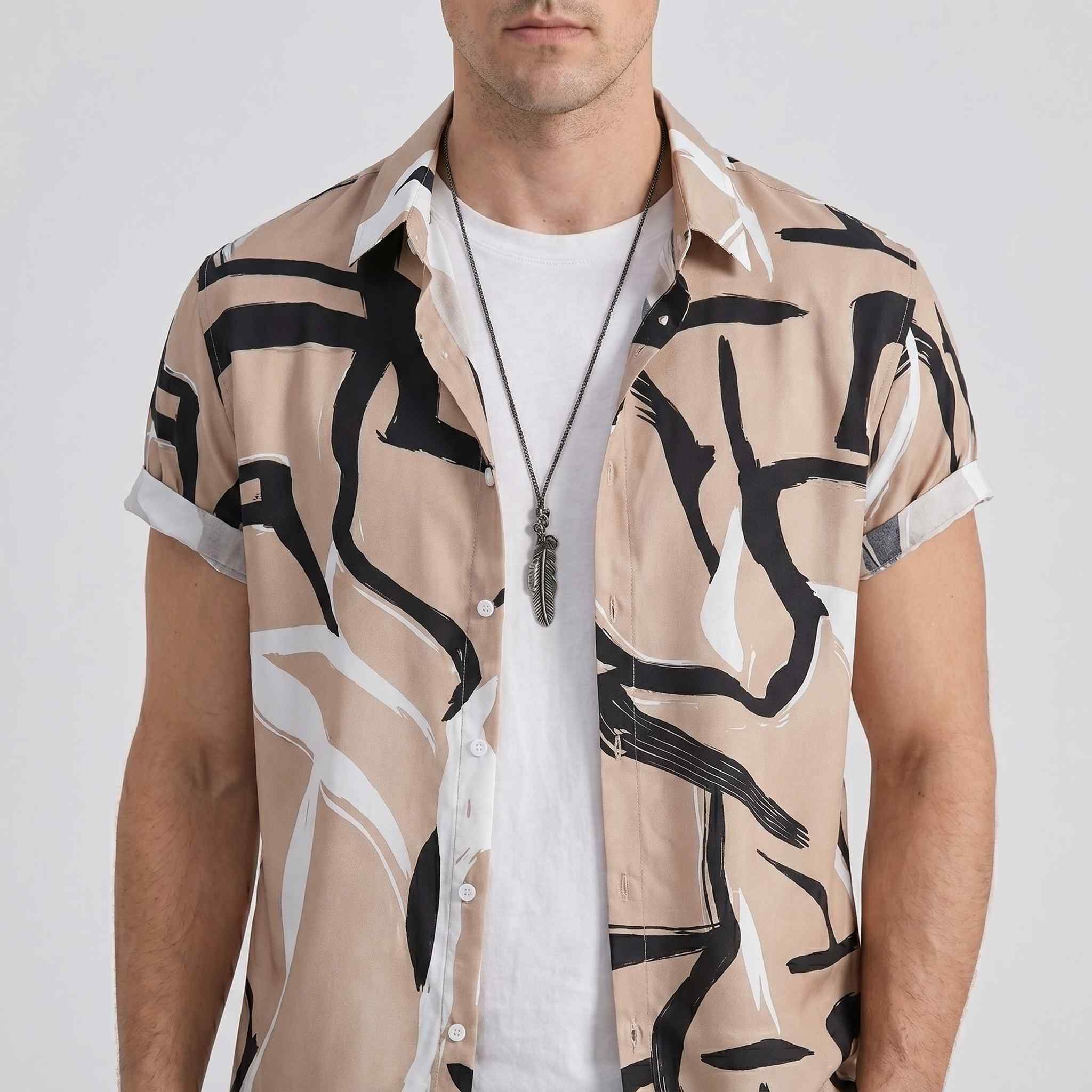 Close-up chest and neckline detail of abstract print camp shirt