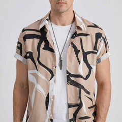 Close-up chest and neckline detail of abstract print camp shirt