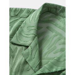Close-up of green jacquard shirt fabric