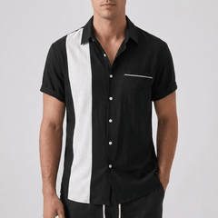 Front Shirt view of man wearing a black outfit against a gray background