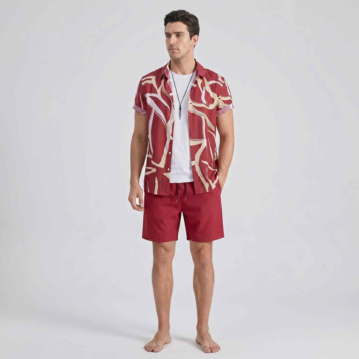 Full front angle of men’s abstract print shirt and swim shorts set