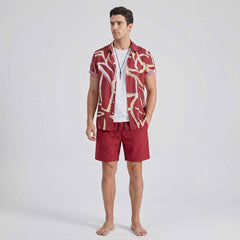 Full front angle of men’s abstract print shirt and swim shorts set