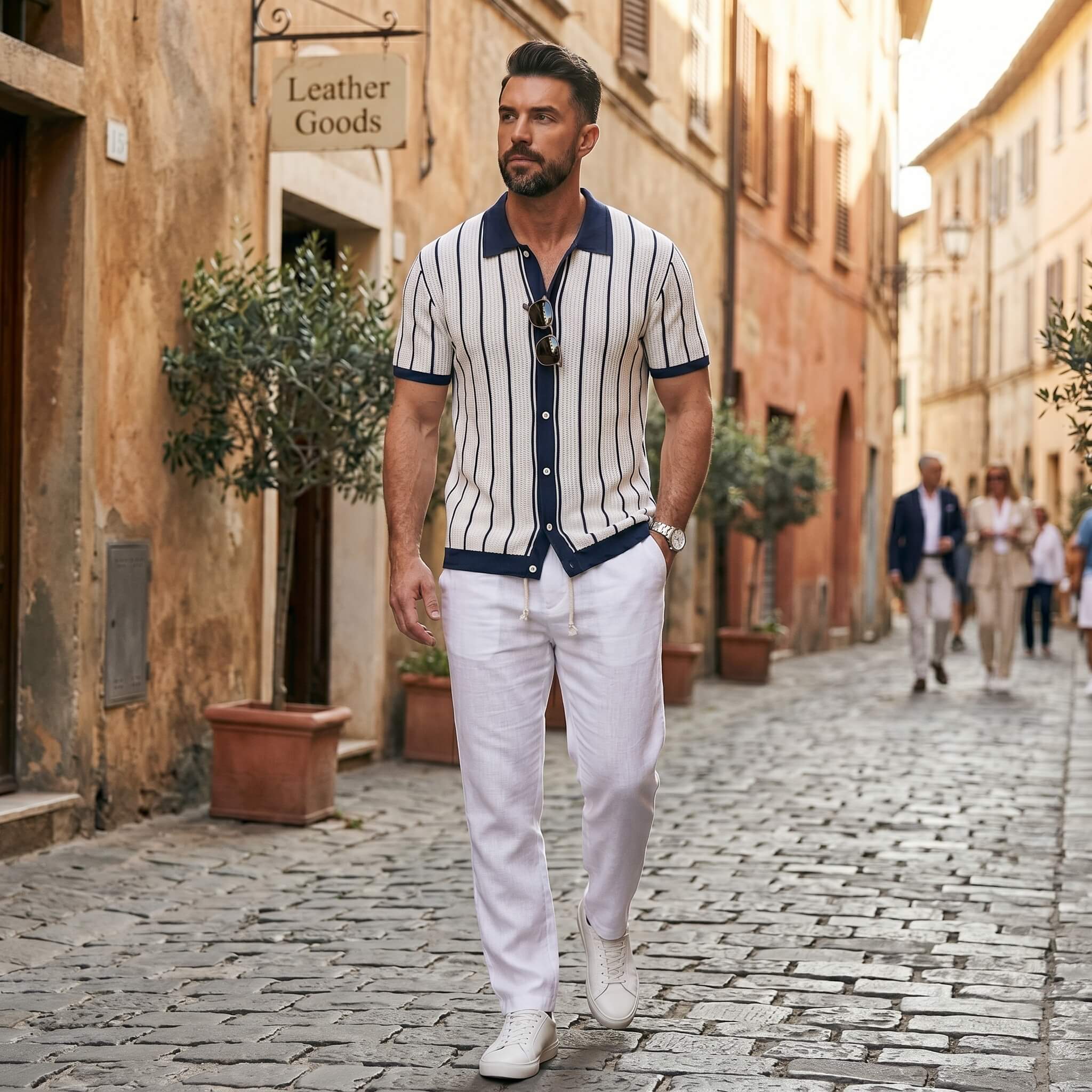 Man walking down a cobblestone street in an urban setting