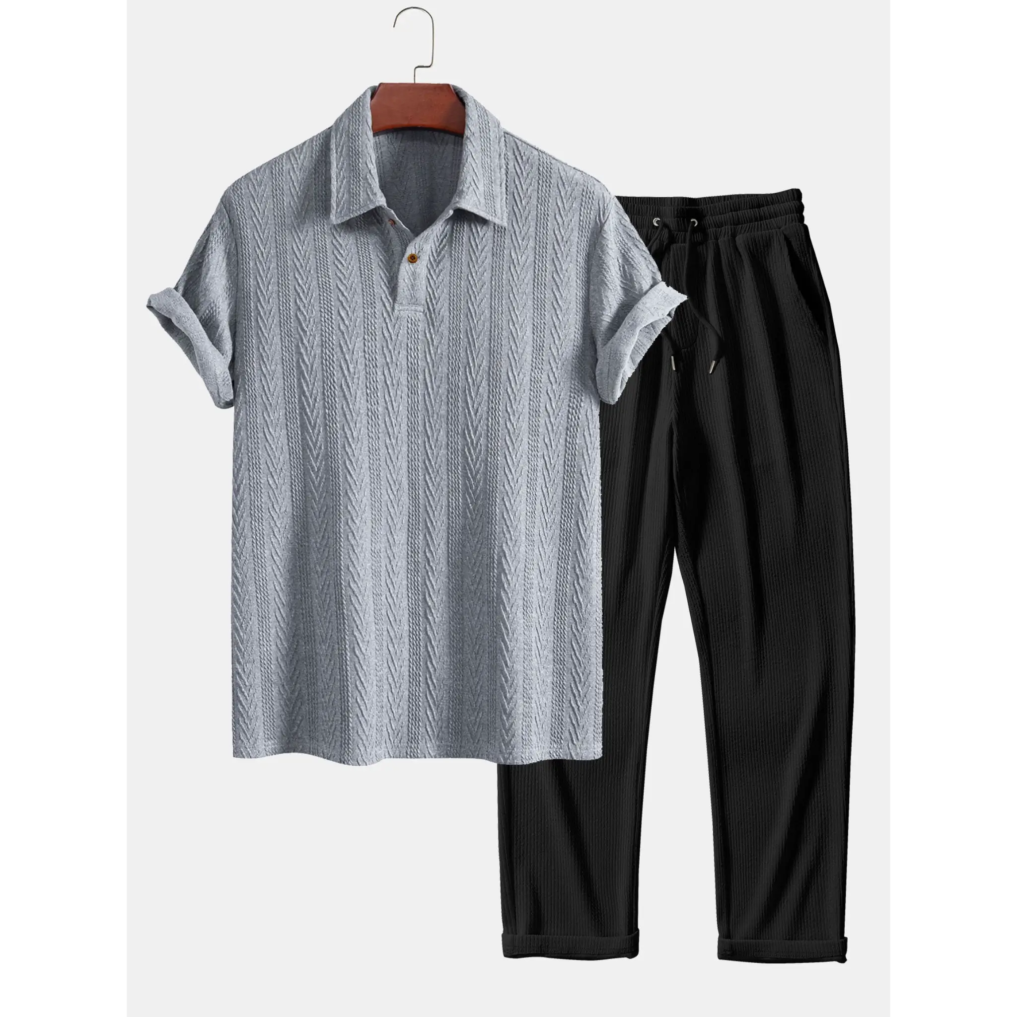 Gray textured polo shirt and black pants on a white background