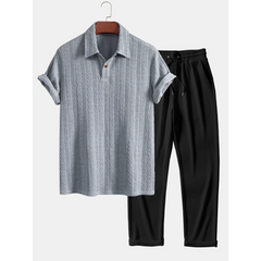 Gray textured polo shirt and black pants on a white background