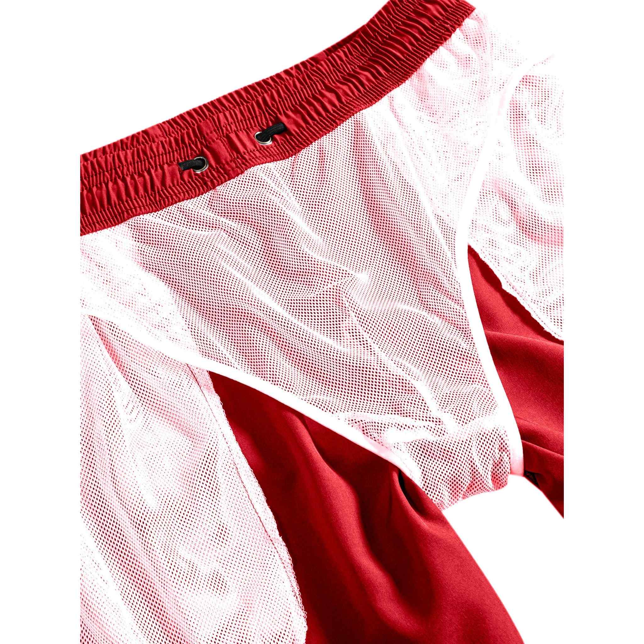 Interior mesh lining detail of red swim shorts