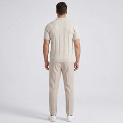 Man wearing a beige outfit on a white background