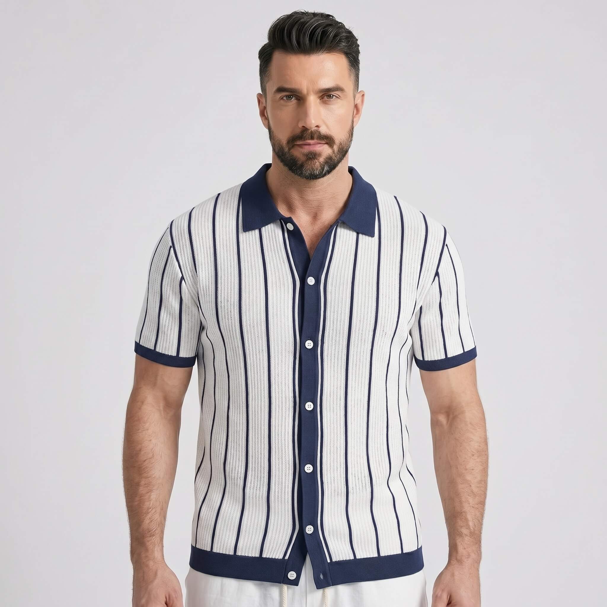 Man wearing a white and navy striped shirt with a collar on a light gray background