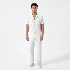 Man wearing a white outfit with a shirt and pants on a white background