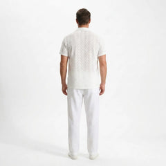 Man wearing a white outfit on a white background