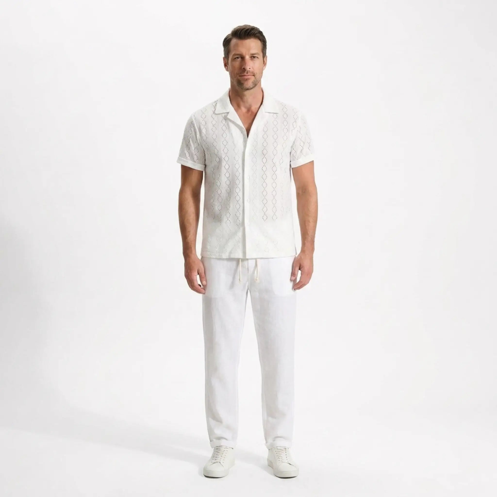 Man wearing a white shirt and pants on a white background