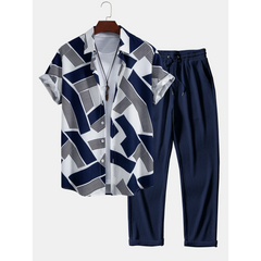 Navy and white patterned shirt with matching pants on a hanger against a white background