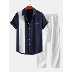 Navy and white striped shirt with matching pants on a hanger against a white background