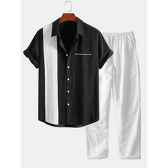 Navy and white striped shirt with matching pants on a hanger against a white background