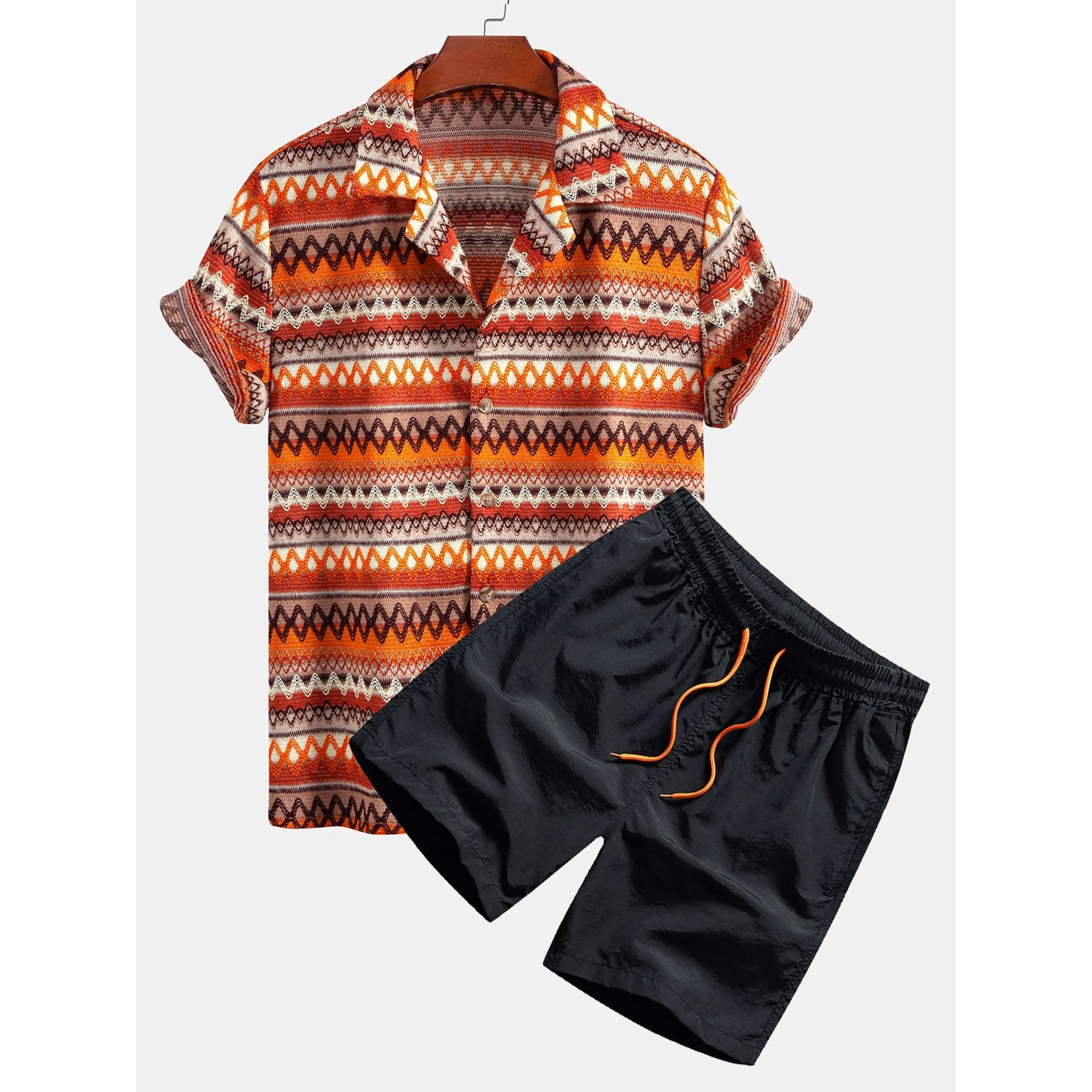 Patterned shirt and black shorts on a white background
