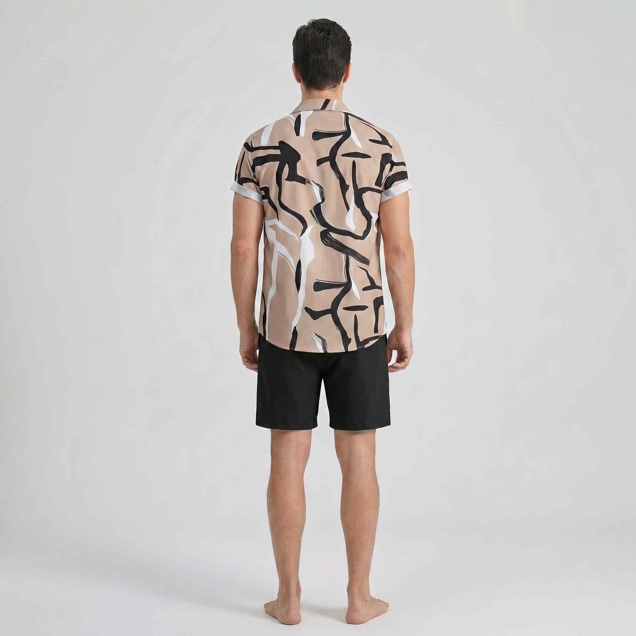 Rear back view of beige abstract print men’s summer outfit