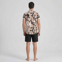 Rear back view of beige abstract print men’s summer outfit