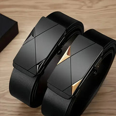 Two black automatic buckle belts on a wooden surface