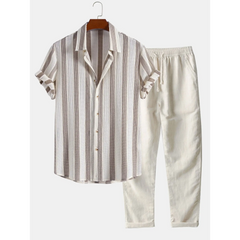 Striped shirt and pants set on a hanger against a white background
