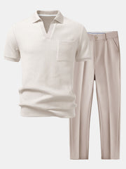 White ribbed polo shirt and beige pants on a white background