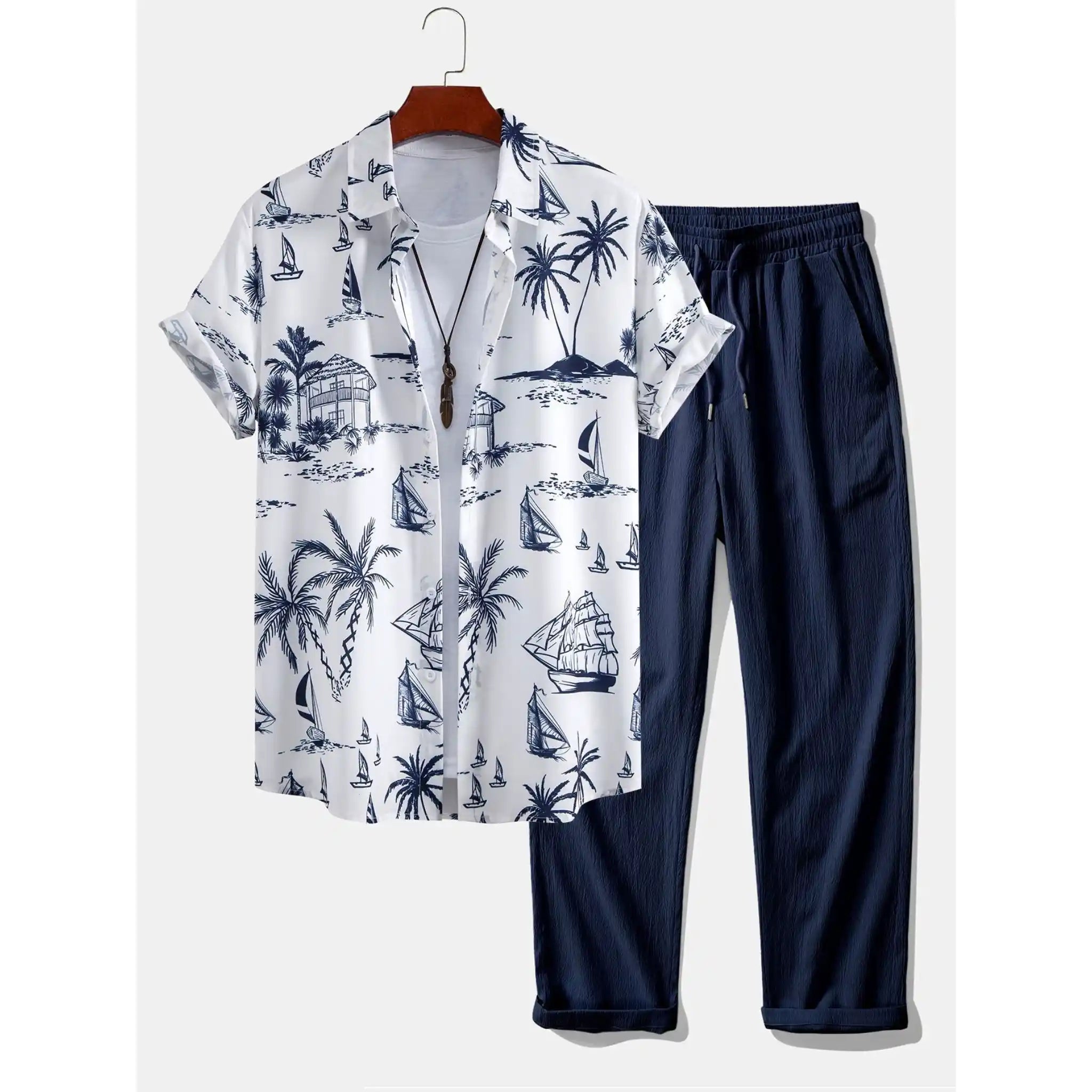 White shirt with black patterns and navy pants on a white background