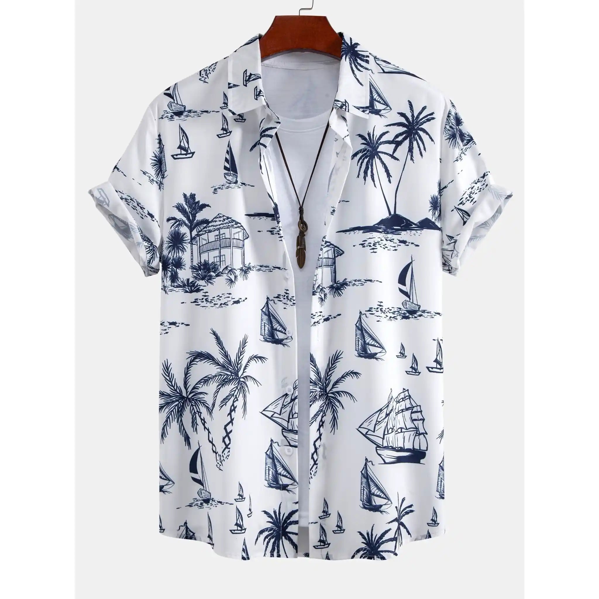 White shirt with blue island-themed pattern on a hanger against a white background