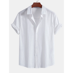 White short-sleeve shirt on a hanger against a white background