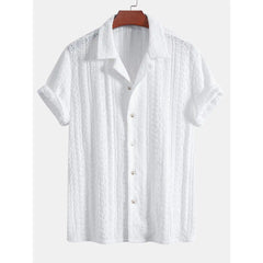 White short-sleeve shirt on a hanger with a white background