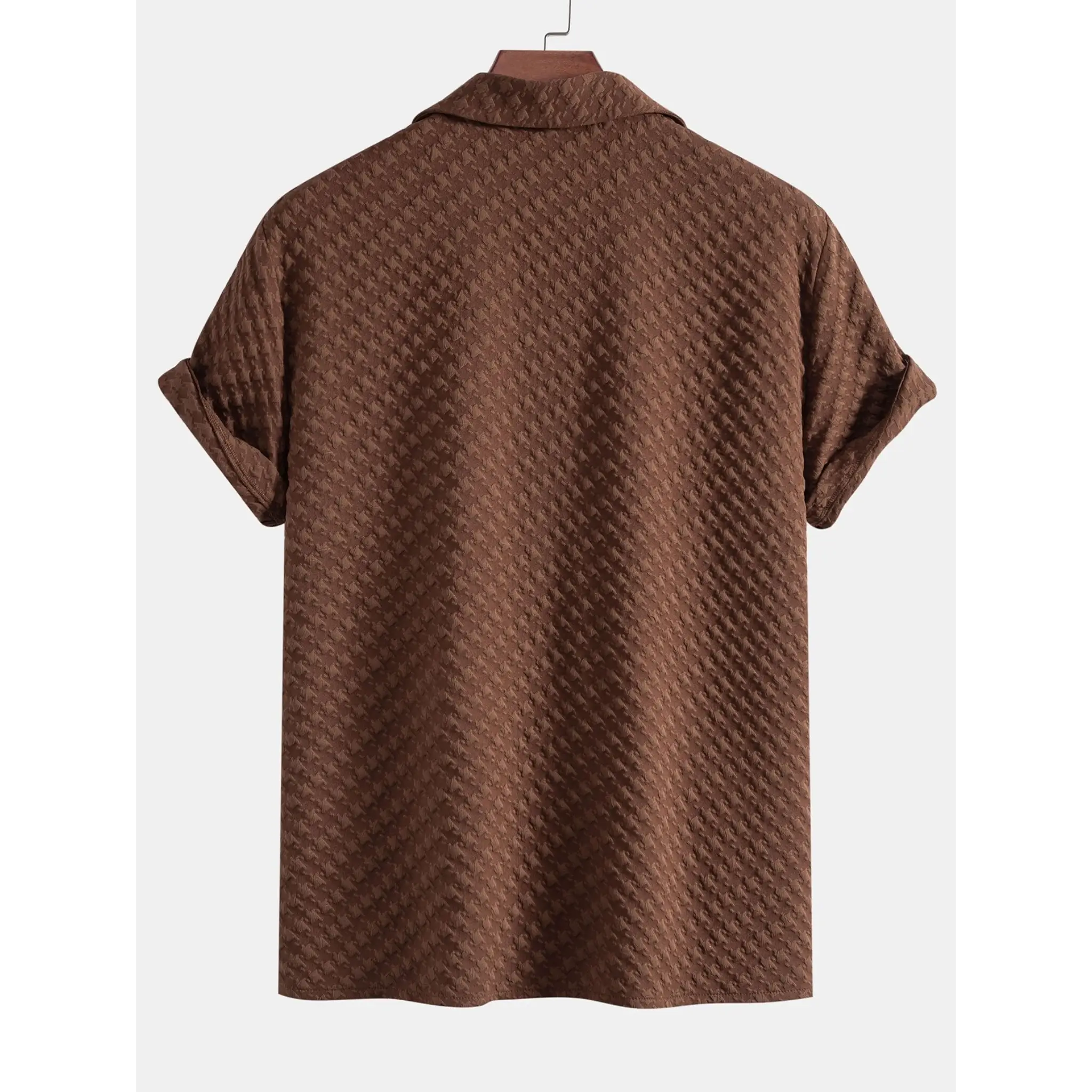 coffee textured shirt on a hanger against a white background