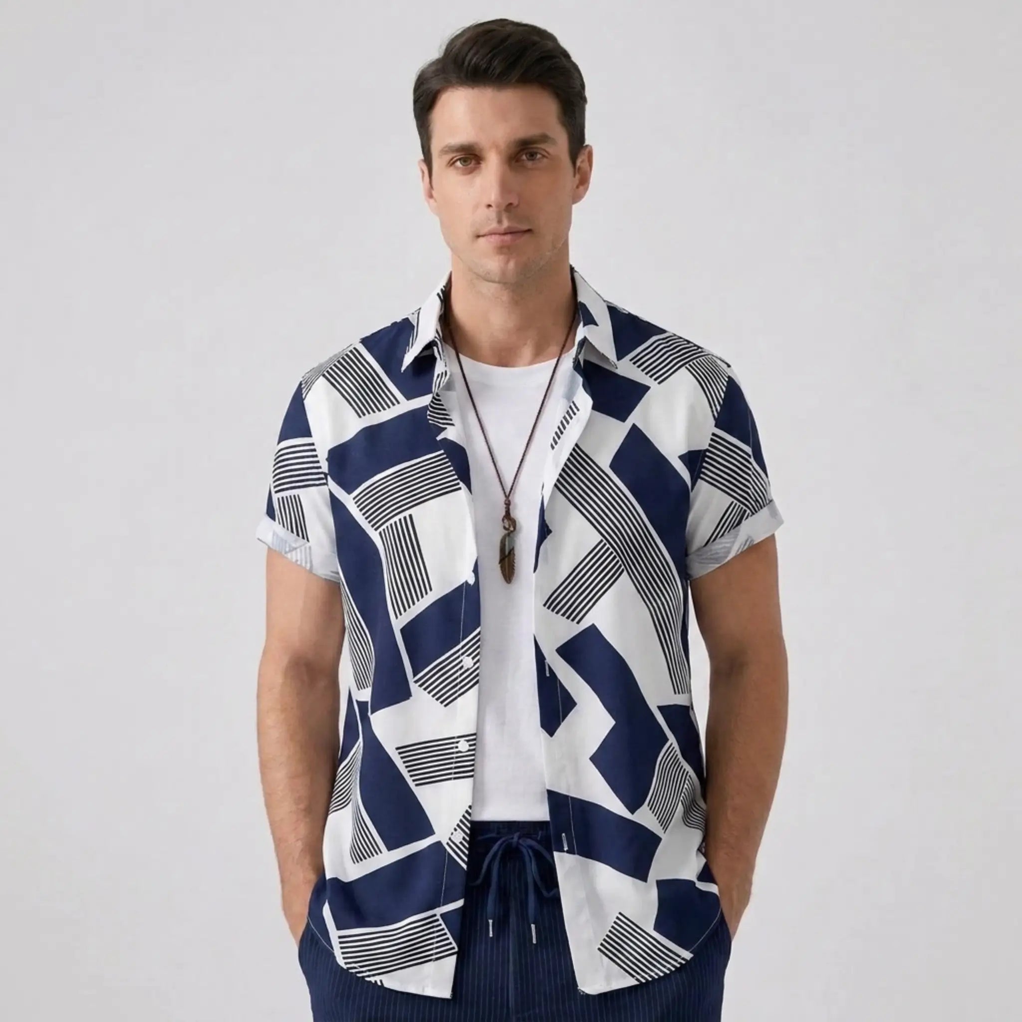 front view of man wearing a pattern shirt in blue and white
