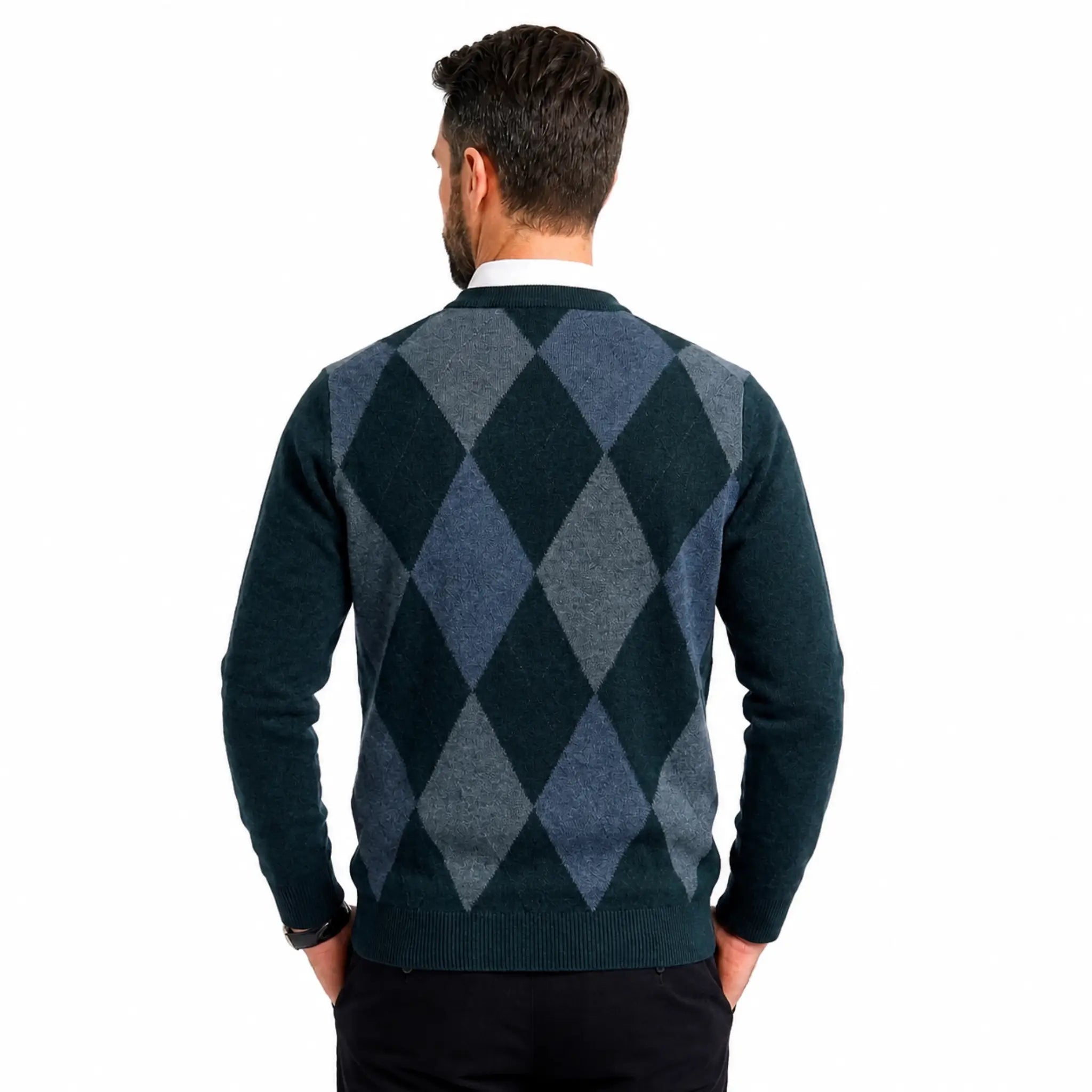 A man viewed from behind wearing a dark green and slate blue argyle sweater over a white collared shirt, set against a plain white background.