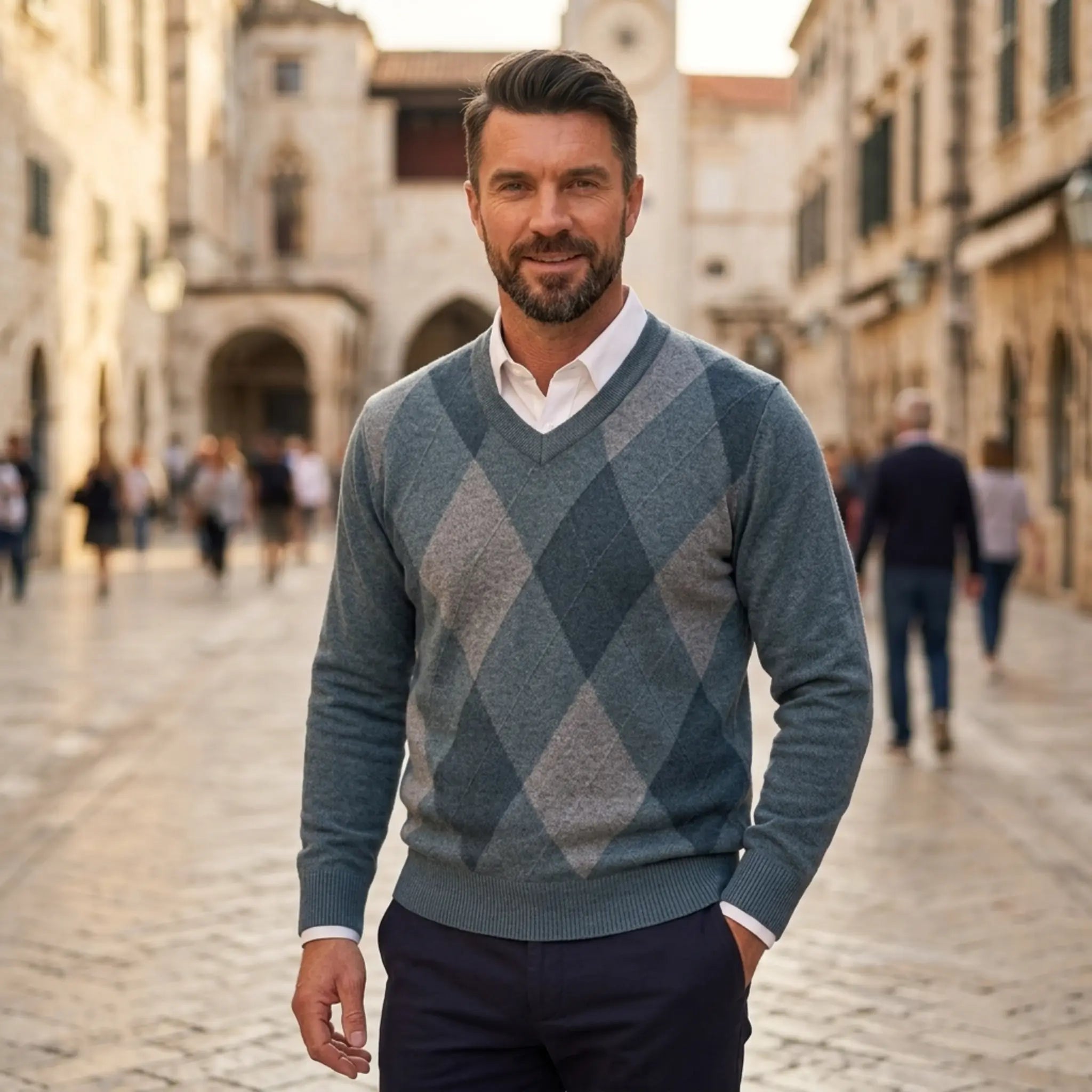 Man wearing MannerCo green argyle V-neck knitted wool sweater slim fit, front view on plain background