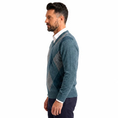 Man wearing MannerCo green argyle V-neck knitted sweater slim fit, front view lifestyle