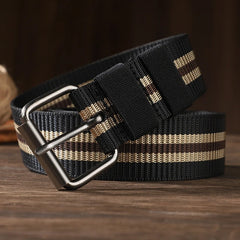 Close up of silver pin buckle on army green striped canvas braided belt showing adjustment holes