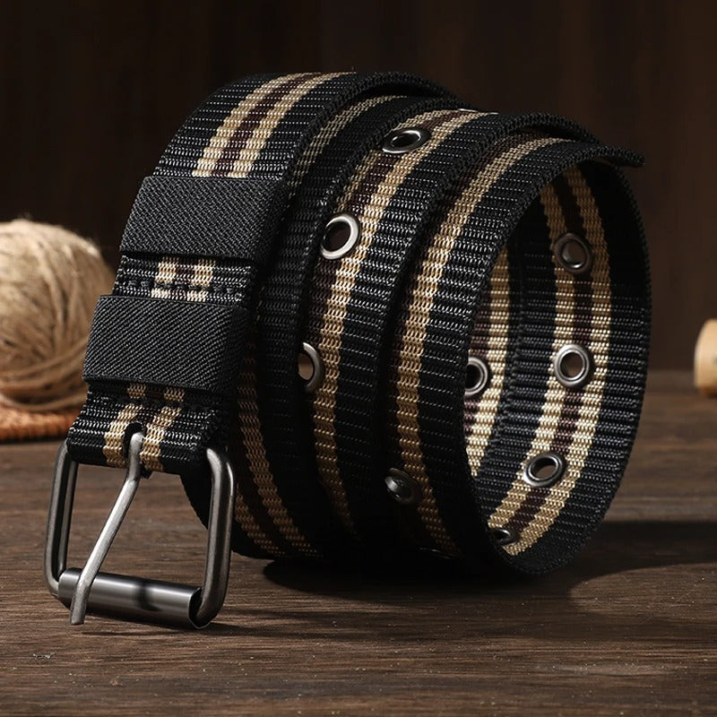 Man wearing army green striped canvas braided belt with silver pin buckle on casual outdoor outfit