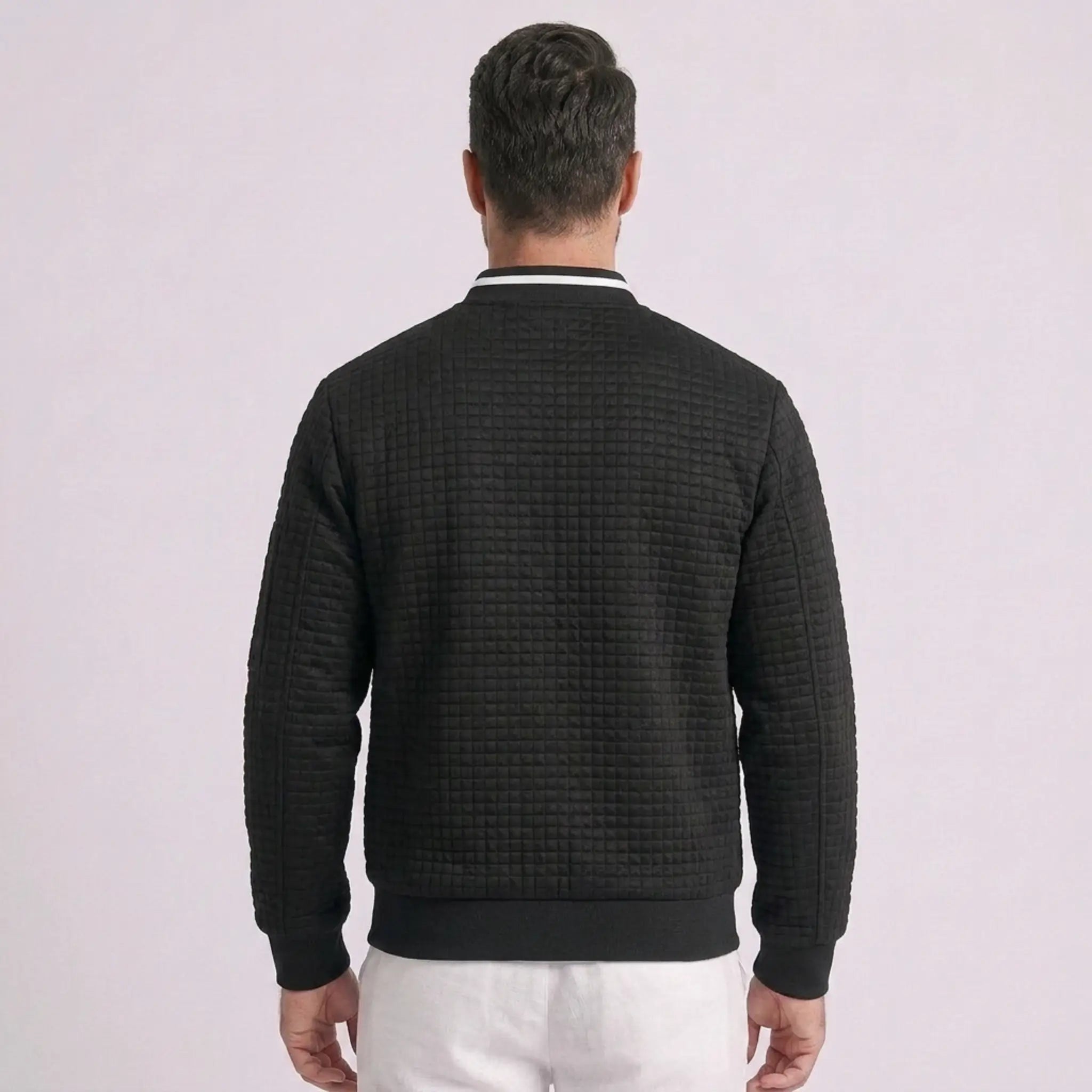 MannerCo black quilted zip-up baseball jacket back view with stand collar and ribbed cuffs