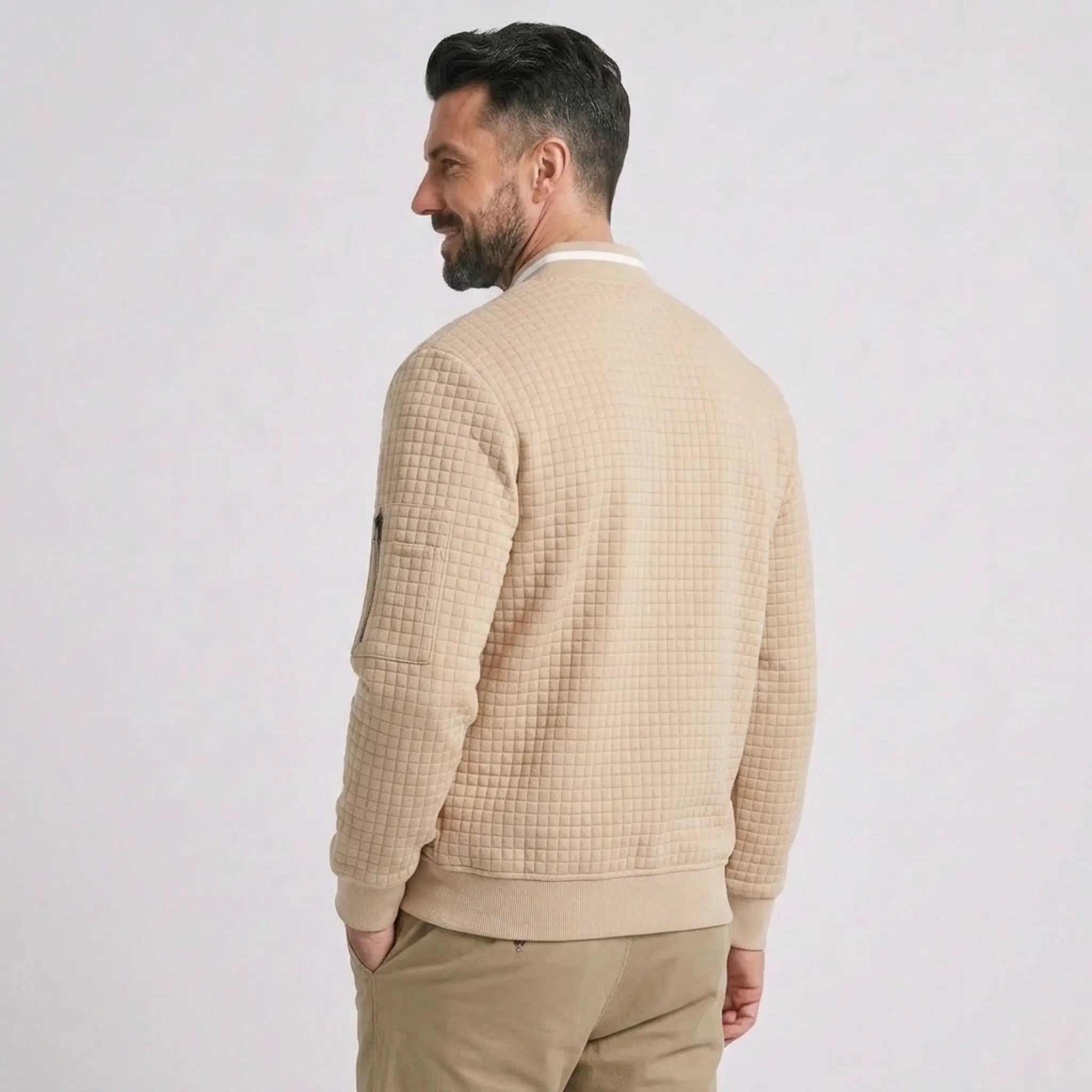 MannerCo khaki quilted zip-up baseball jacket back view with ribbed hem and sleeve pocket